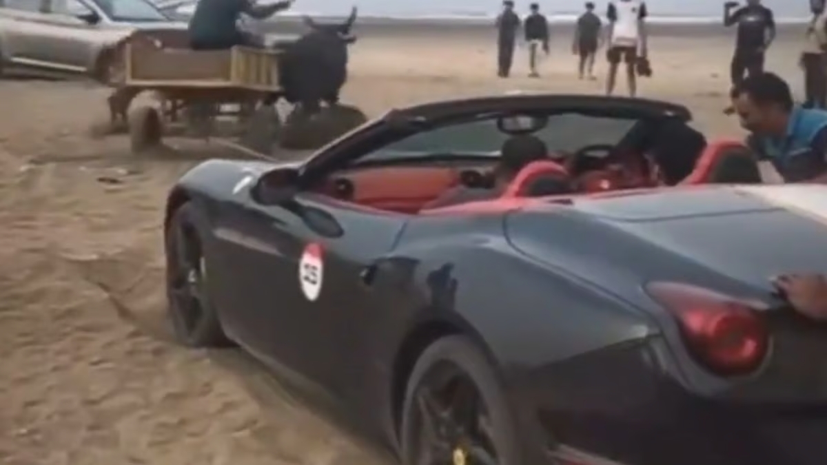 WATCH: Ferrari gets stuck in sand in Indian beach; rescued by bullock cart; video goes viral
