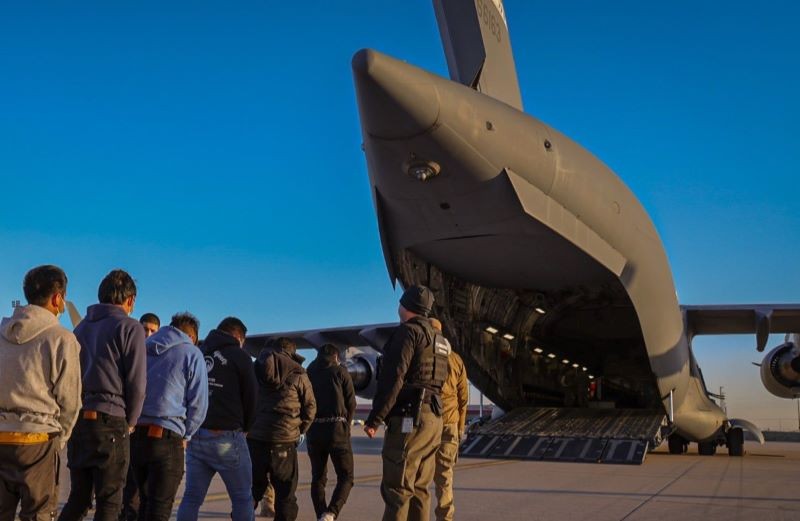 Illegal immigrants boarding a US Army flight. Photo courtesy: Screengrab from X