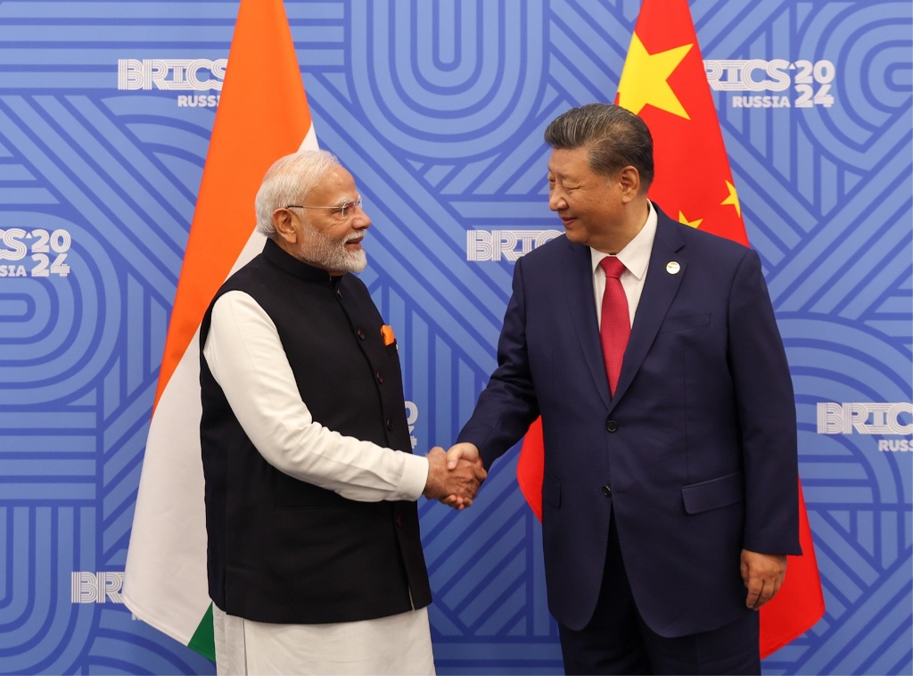 Indian Prime Minister Narendra Modi (left) shakes hand with China's Xi Jinping during their meeting at the BRICS Summit in Kazan, Russia in October 2024. Photo courtesy: x.com/narendramodi