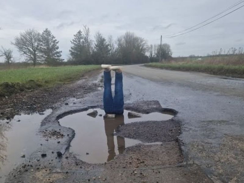 UK man places fake pair of legs in huge pothole to highlight plight of his village