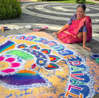 Indian-origin Singaporean artist Vijayalakshmi Mohan with her Deepavali rangoli creation