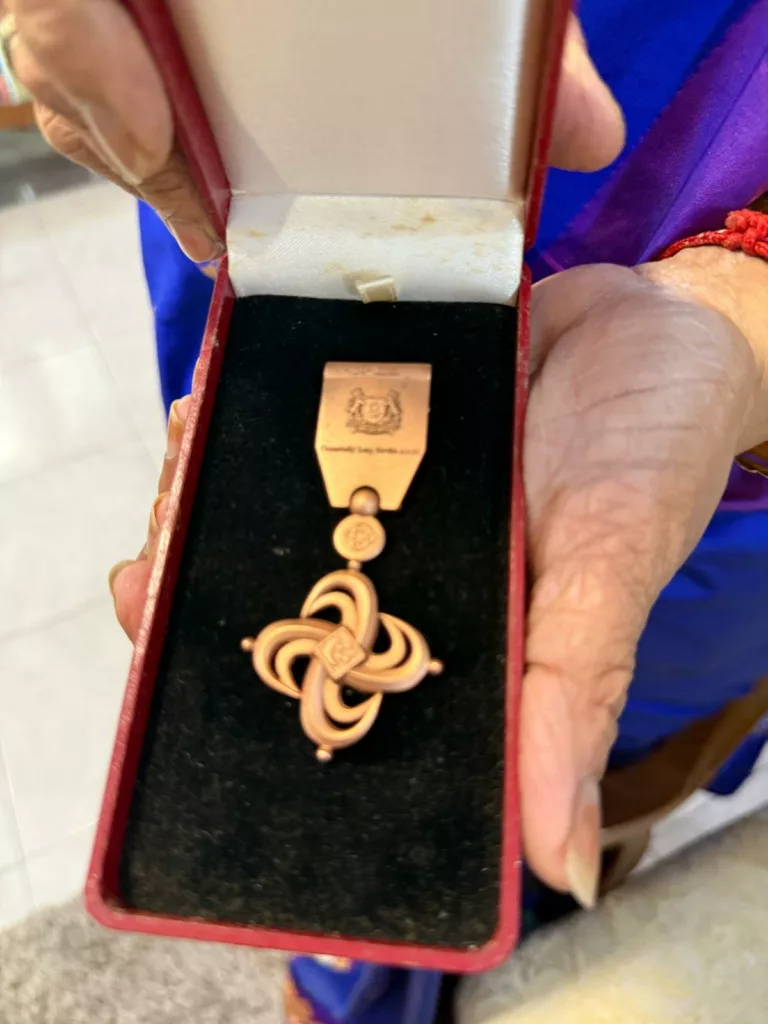 Rangoli pioneer Vijayalakshmi Mohan with her Long Service Award medal