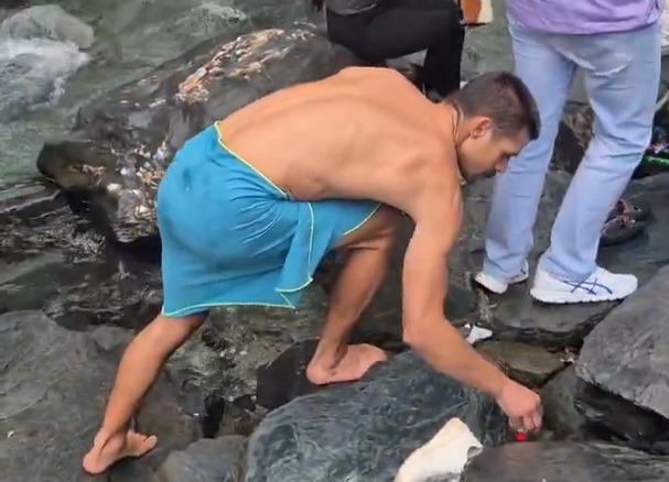 WATCH: Viral video of tourist cleaning Kangra waterfall sparks debate on littering in Himachal