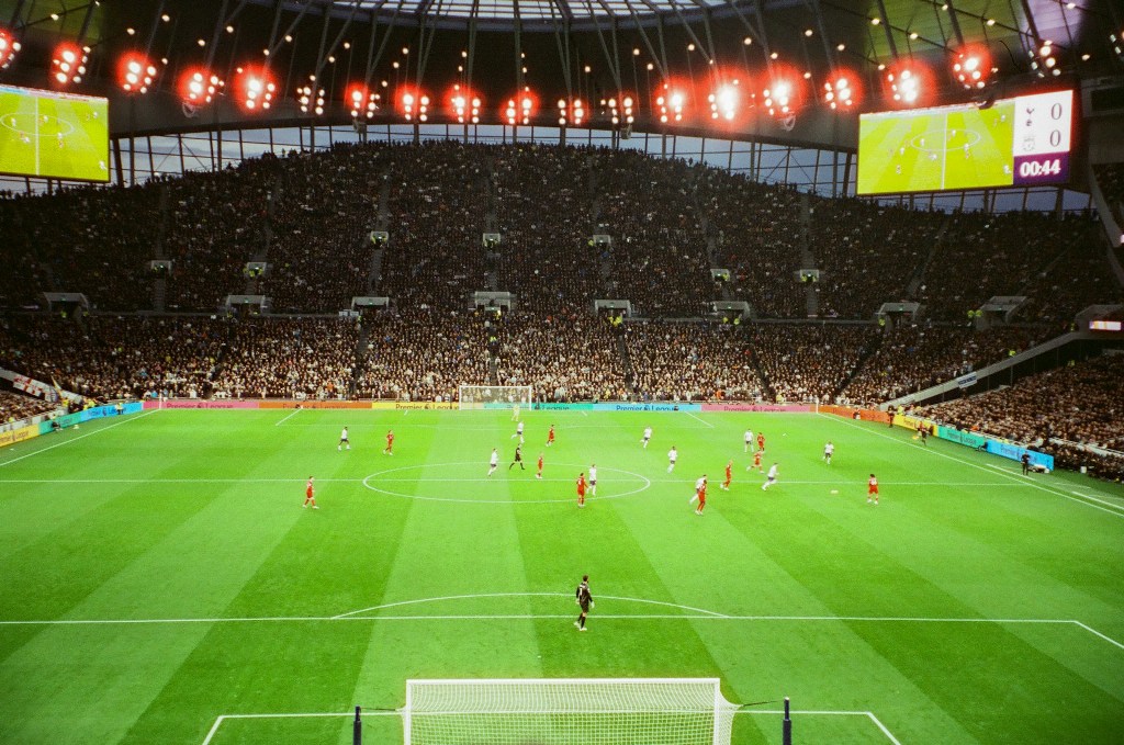 A match being played between Liverpool FC and Tottenham Hotspur F.C. Photo courtesy: Memories on 35mm/Unsplash